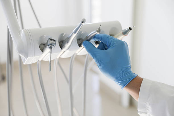 Professional Tooth Extraction technician working in Lake Grove, NY